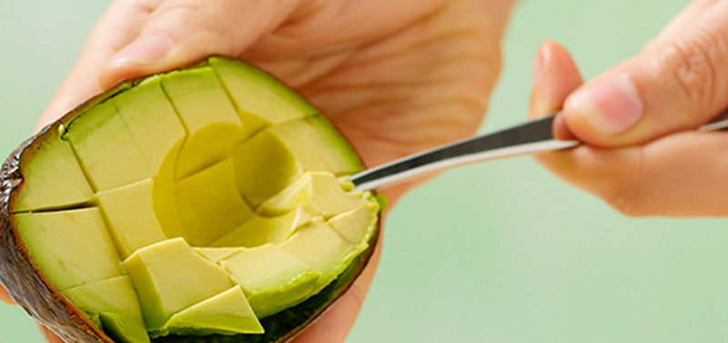 Slicing an Avocado into cubes. Protein in Avocados.