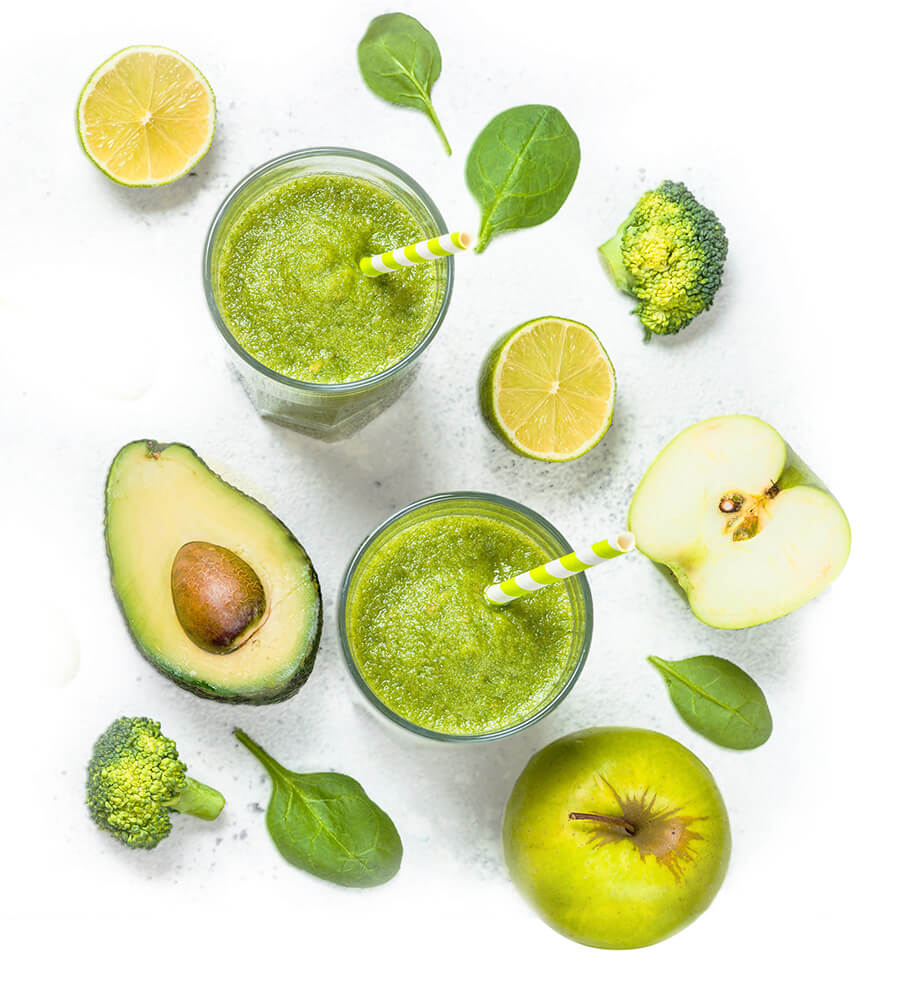 avocado with vegetables fruit and a smoothie