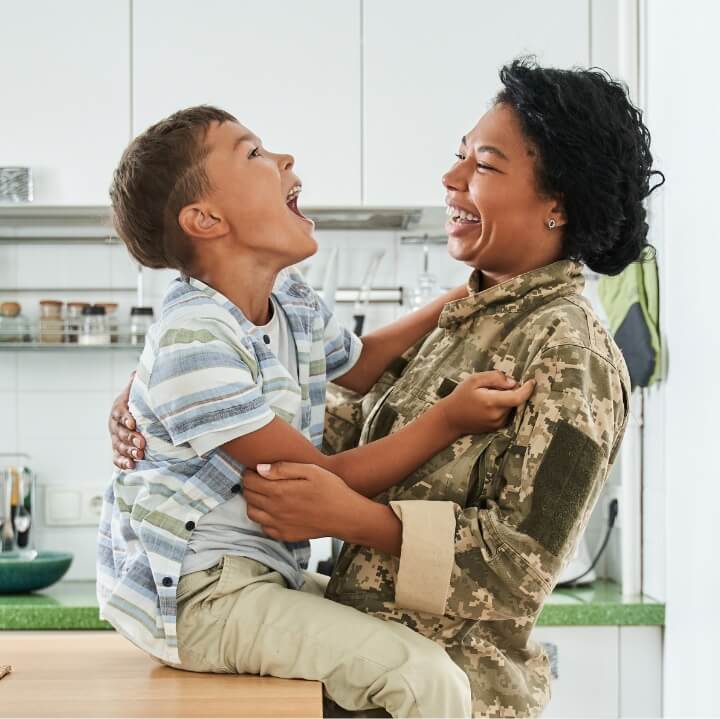 happy veteran with child in kitchen