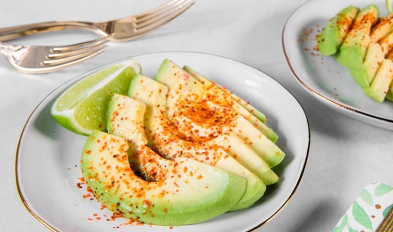 sliced avocado with lime
