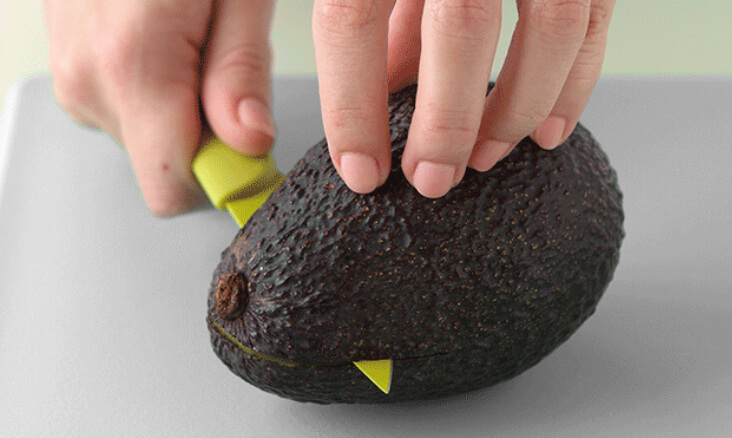 Carefully Cutting A Fresh Avocado for Guacamole